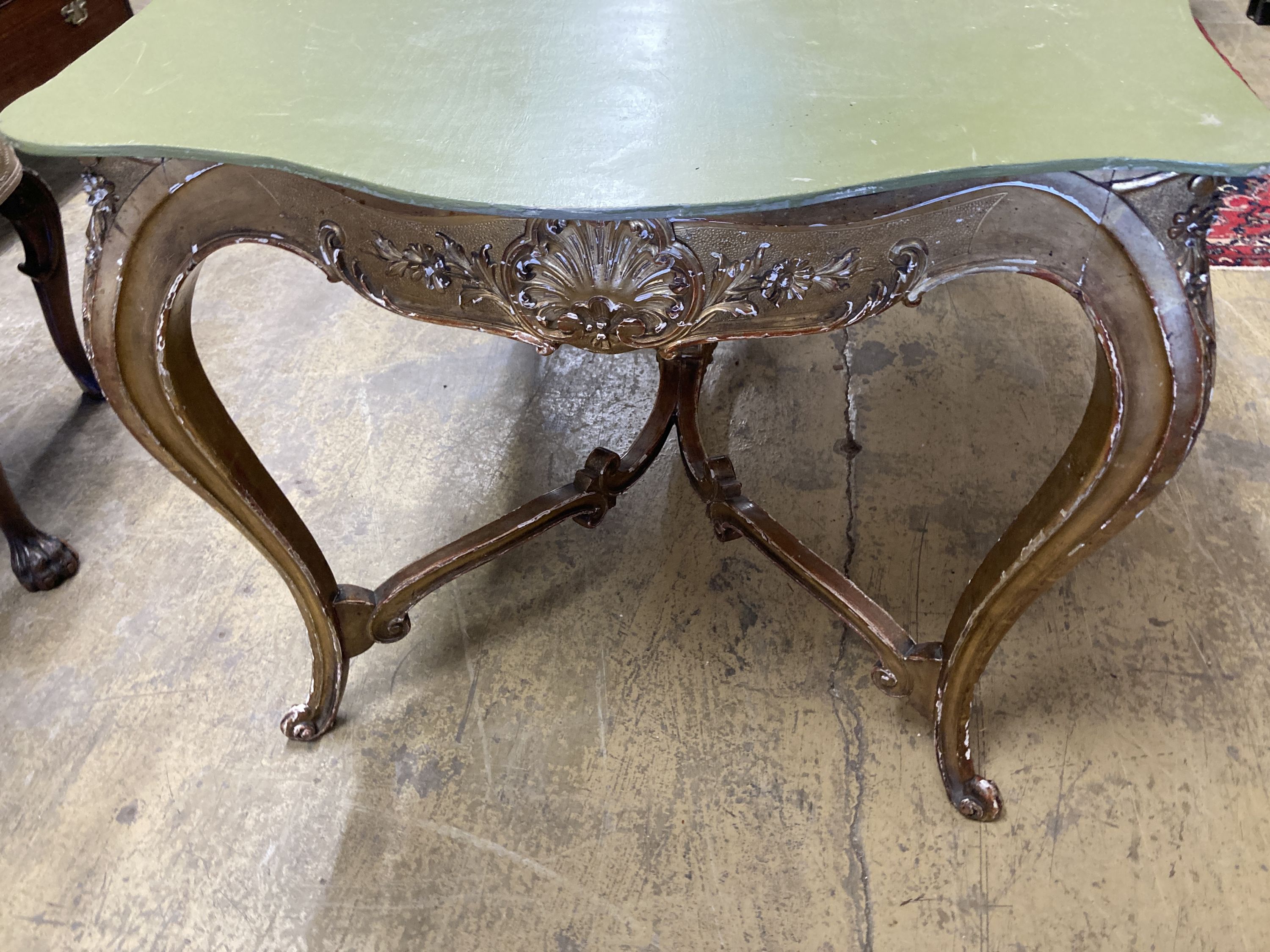 A large 19th century gilt carved wood and plaster cente table (lacking top), width 150cm, depth 85cm, height 72cm
